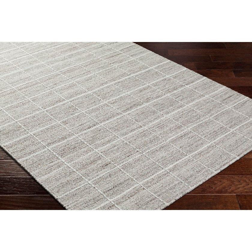 Ishaq Solid and Border Ivory/Tan Area Rug